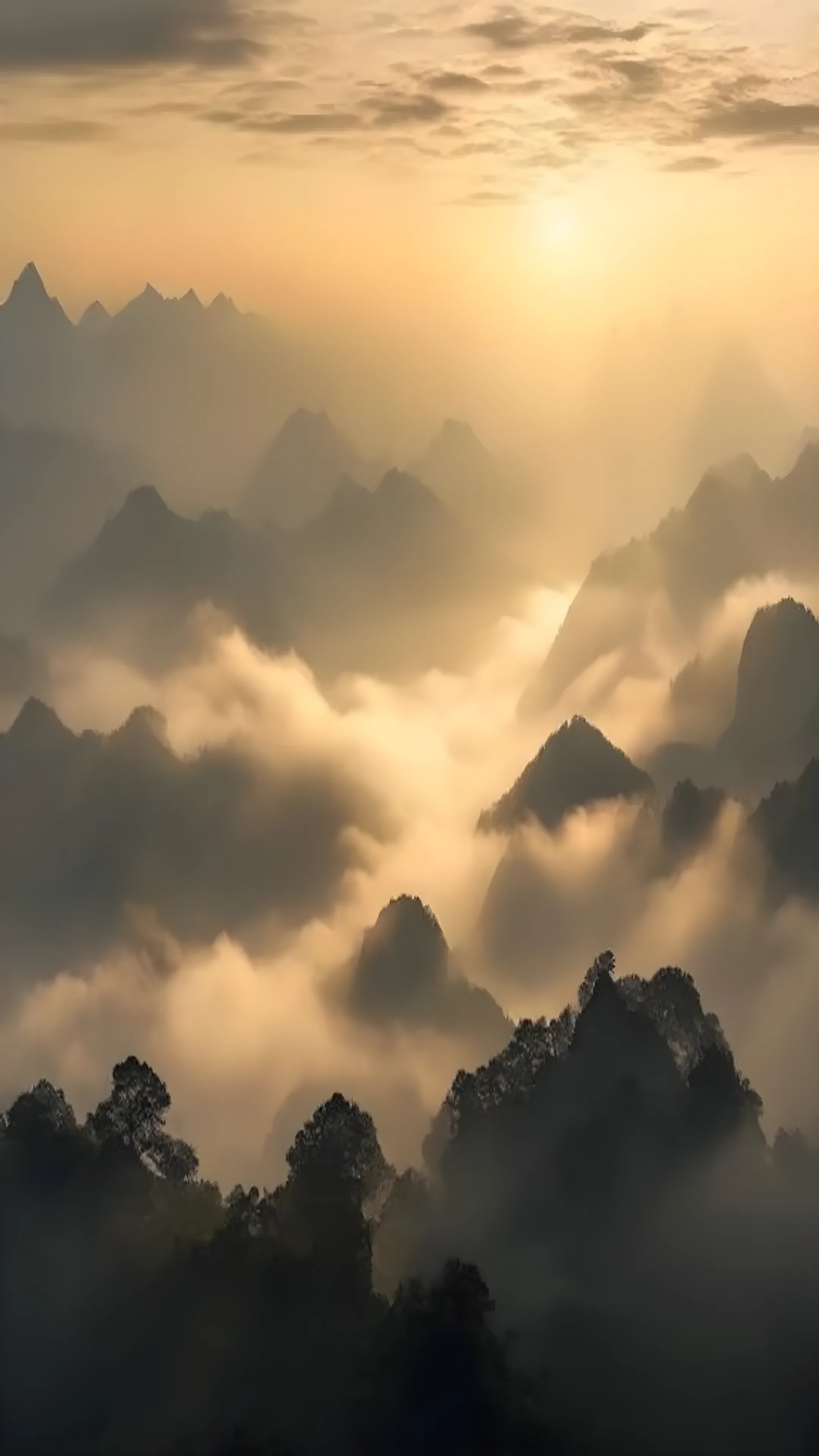 Misty mountain range at sunrise