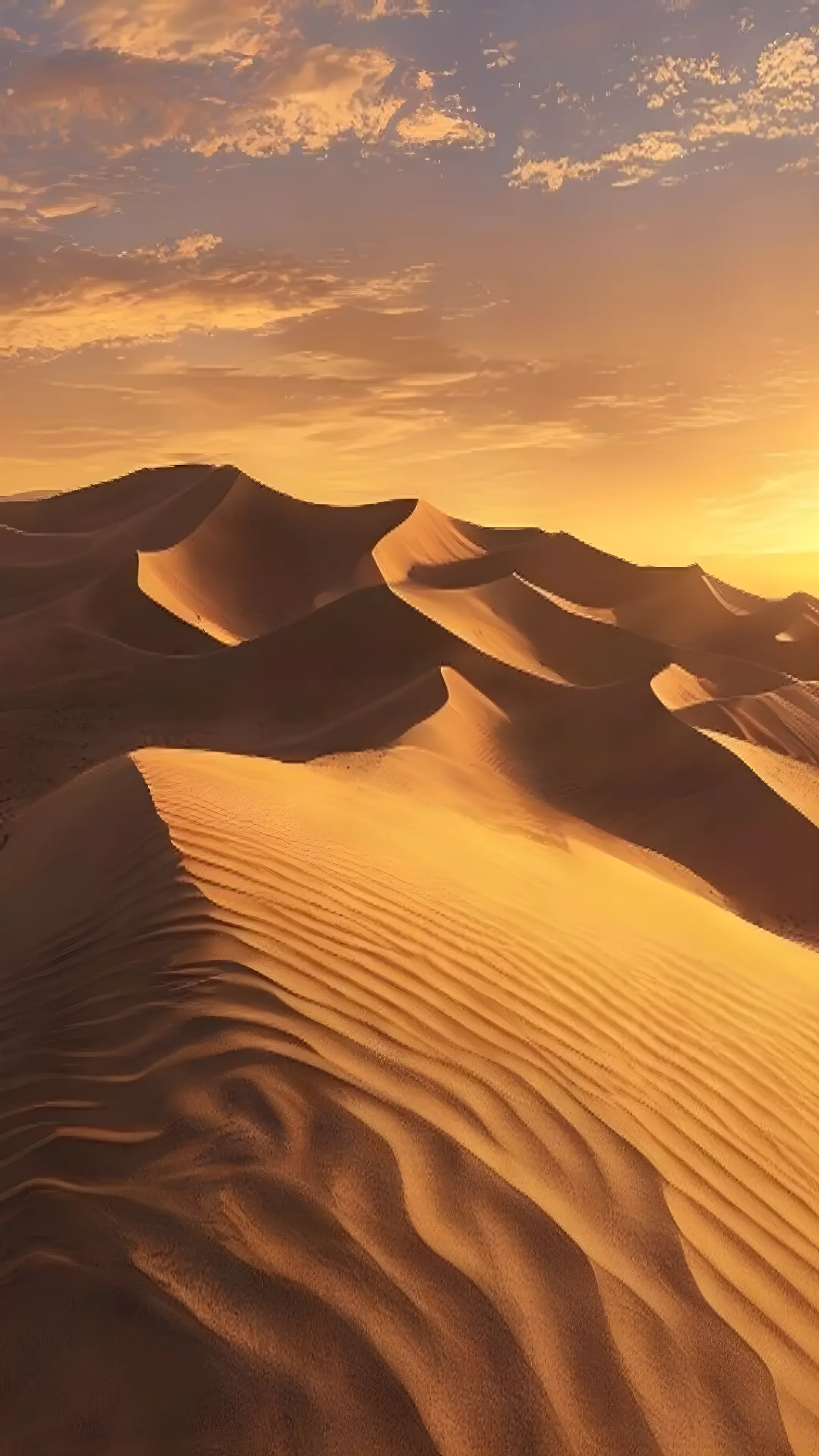 Desert sand dunes at golden hour